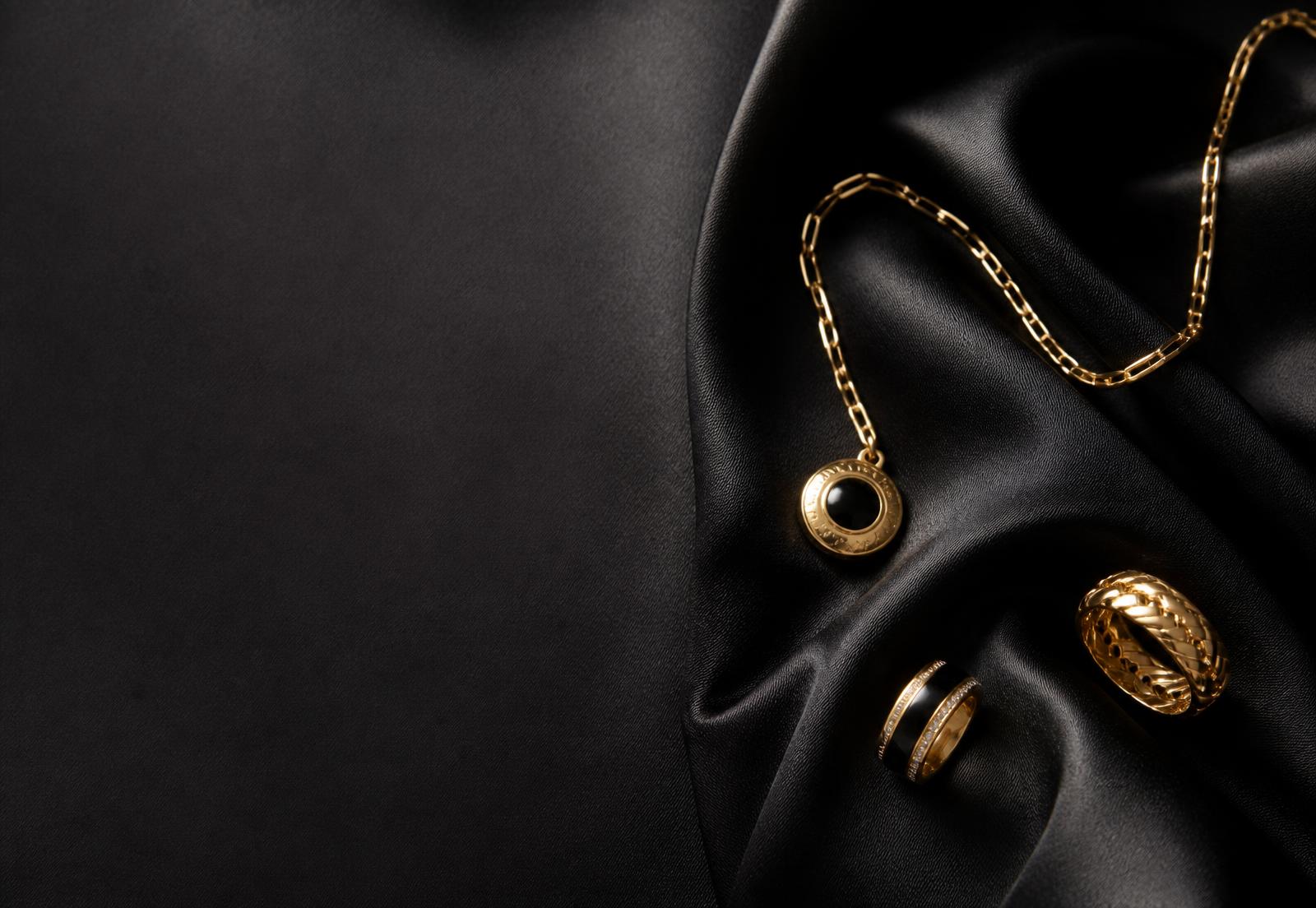 Gold plated Moonelle necklace and rings on dark silk